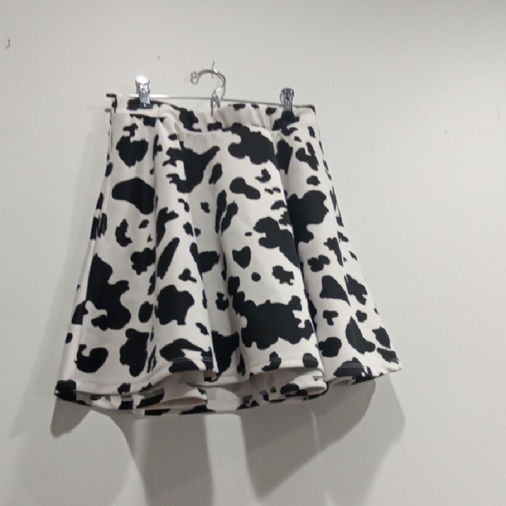 Black and white cow print with pockets